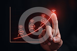 AI generated close-up of a hand interacting with a digital growth chart featuring robot icons symbolizing telecommunications