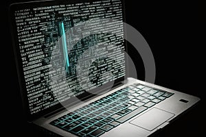 AI generated hacker laptop with binary computer code internet and network security