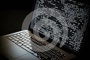 AI generated hacker laptop with binary computer code internet and network security