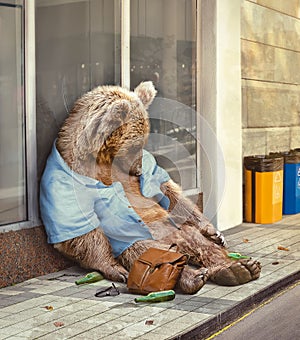 AI generated illustration of an alcoholic brown bear in a blue shirt sleeping on the sidewalk