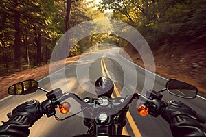 AI-generated illustration of a motorcyclist driving down a winding road in a forest setting