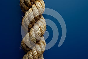 AI generated illustration of a sturdy rope made from tightly woven fibers on a blue background