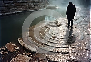AI generated illustration of a surreal scene with a man next to a canal on a rippling rock formation