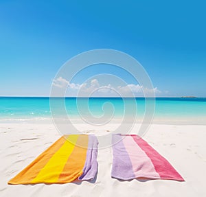 AI generated imaga of towels in rainbow colors on perfect beach photo