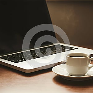 AI Generated: Laptop and Coffee on a Wooden Table photo