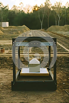 AI generated Large 3D Printer and House Model on Construction Site at Sunset