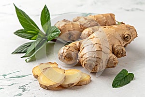 Fresh ginger root isolated on white surface