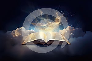 Opened bible in the sky with rays of light coming from above