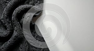 Dark grey cable knit blanket cozy style in charcoal and light grey for comfort with copy space (AI-generated) photo