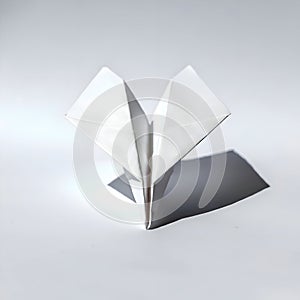 AI-Generated Image: White Paper Airplane on a White Surface