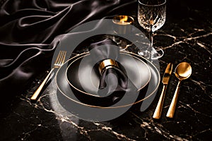 Elegant Black And Gold Luxury Table Setting With Refined Fine Dining Atmosphere
