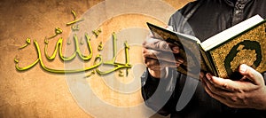 `AI HamduLillah` thanks to God of Islam, Arabic alphabet and Koran in hand - holy book of Muslims public item of all muslims