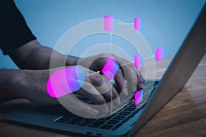 people hand working on laptop computer with digital flowchart database diagram