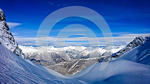 Aibga mountain peak covered by snow. Gorki Gorod ski resort. Sochi, Russia