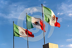 Three Mexican flags photo