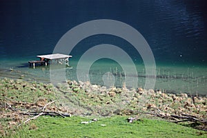 Aiguebelette lake and wooden pontoon, Savoy, France