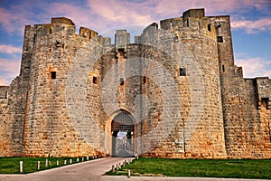 Aigues-Mortes, Gard, Occitania, France: the city gate in the med