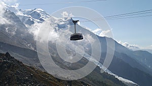 Aiguille de Chamonix cable car ascending to the Aiguille de Midi and Mont Blanc in France.