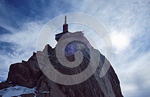 The Aiguille du Midi is a mountain in the Mont Blanc massif within the French Alps