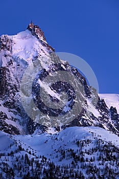 Aiguille du Midi needle at twilight. Mont Blanc mountain range, Chamonix, Haute-Savoie, France