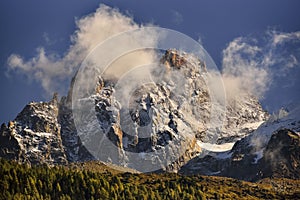 Aiguilles mountain range peaks and blue sky and red clouds