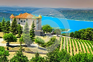 Aiguines castle with St Croix lake in background, Provence, France, Europe