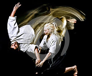 Aikido budokas man and woman isolated black background photo