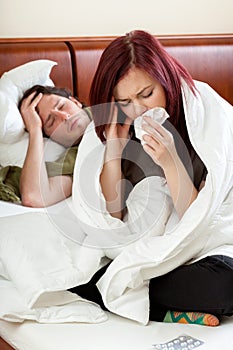 Ailing couple in bedroom