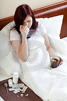 Ailing woman drinking tea