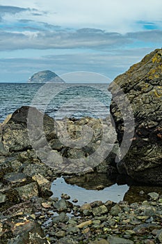 Ailsa Craig viewed from rocky beach near Lendalfoot Ayrshire, Scotland