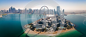 Ain Dubai ferris wheel on Bluewaters island with amazing Dubai skyline in the UAE