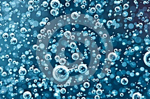 Air bubbles in blue water. Macro