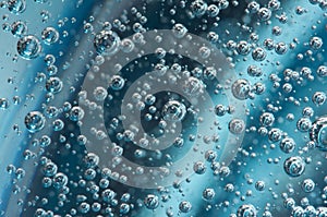 Air bubbles in blue water. Macro