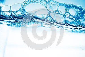 Air bubbles in blue water