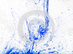 Air bubbles on glass and dissolving blue ink