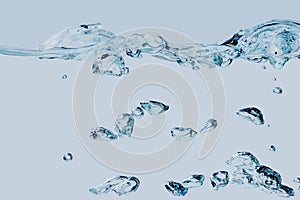 Air bubbles isolated on light blue upwards