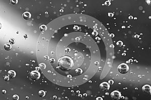 Air bubbles in liquid. Abstract black-and-white background