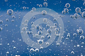 Air bubbles in a liquid. Abstract blue background