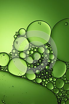 Air bubbles in liquid green tone background