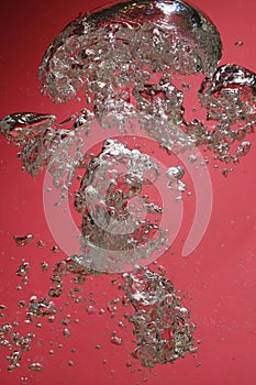 Air bubbles on red background