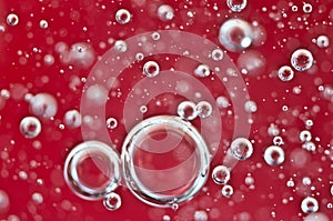 Air bubbles in red water. Macro