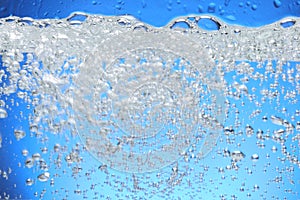 Air bubbles rise from the water