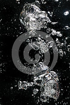 Air bubbles rising in water