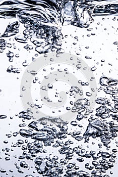 Air bubbles water close on a white background