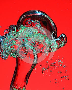 Air bubbles in water on red