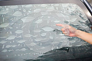 Air bubbles on window film of a car