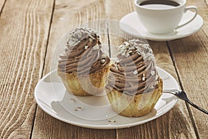 Air cake in a basket with chocolate cream and coffee