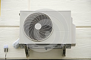 Air compressor fan on wall