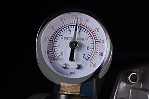 Air compressor manometer close-up. Pressure gauge measurement
