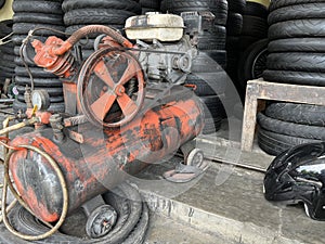 Air compressor used in a auto shop for inflating tire.